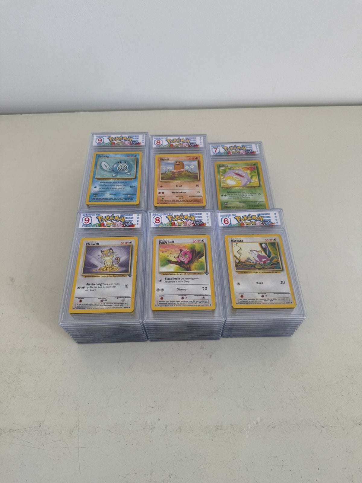 Nederlandse Pokémon Graded Slabs | Lot Vintage - 60 slabs, Enlèvement, Comme neuf, Plusieurs cartes