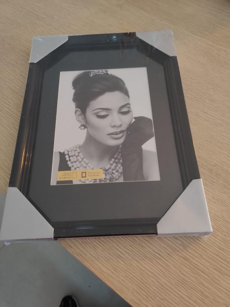 Fotokader nieuw, Ophalen