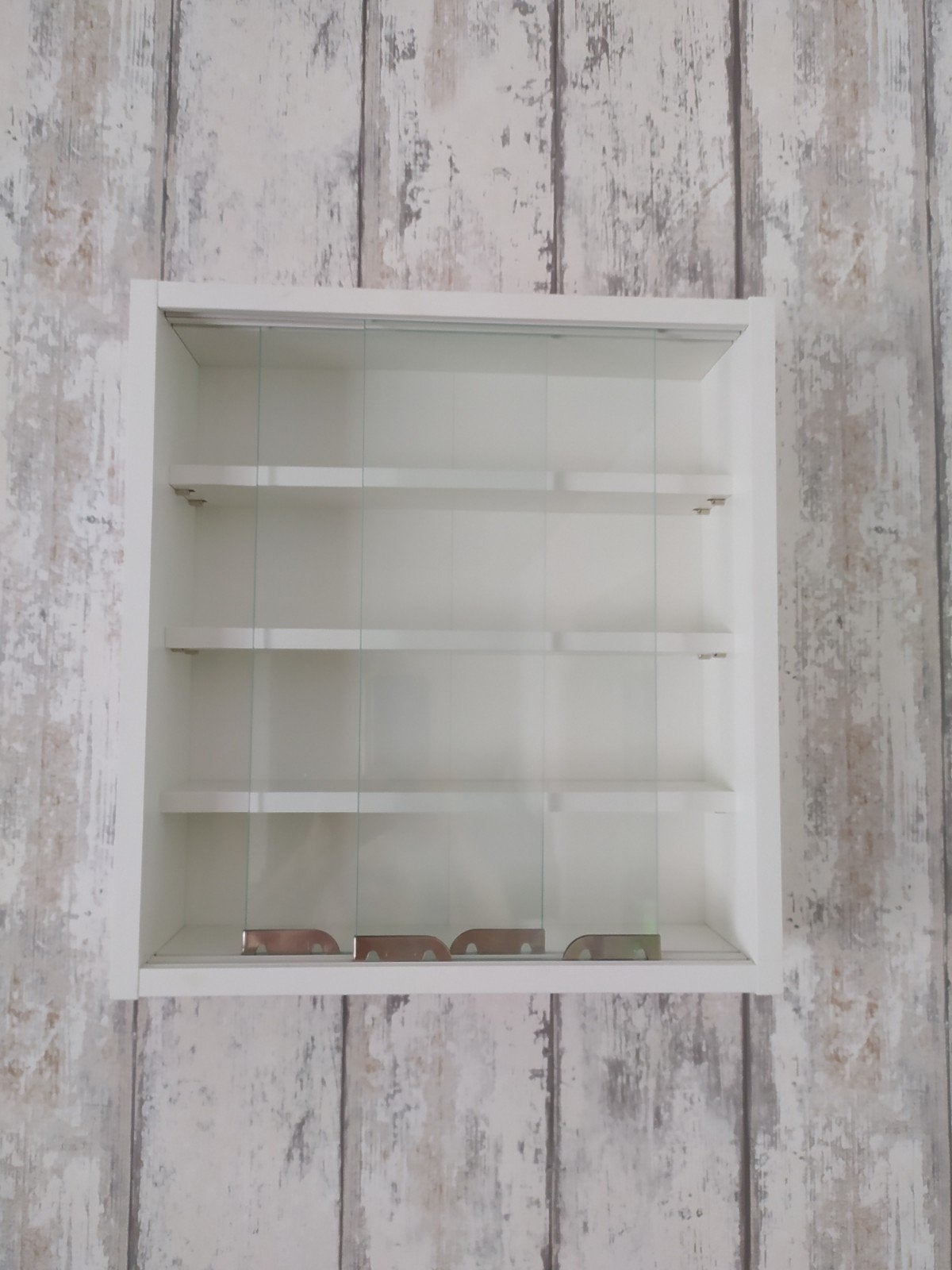 wand vitrine kastje, Ophalen