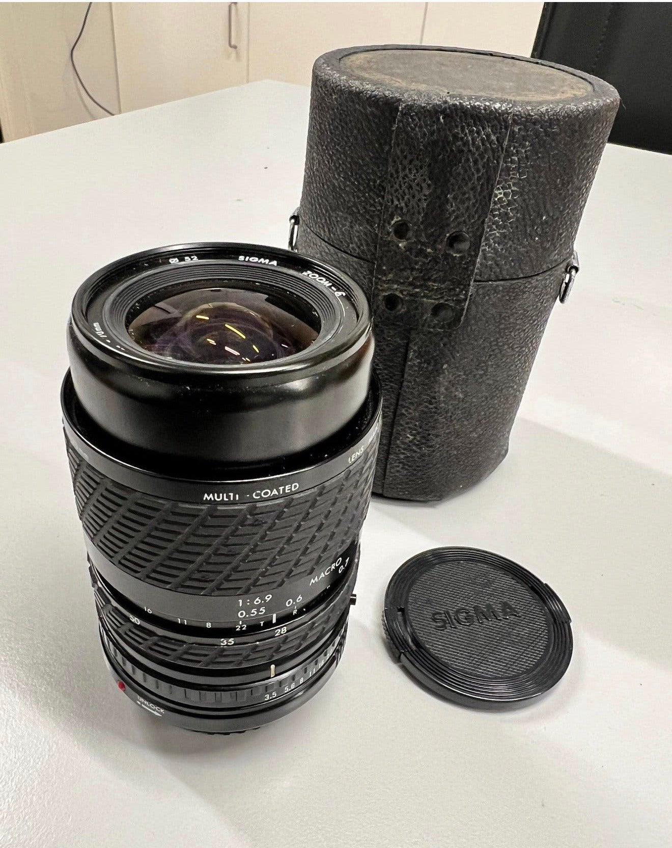 Sigma Zoom-E 1:3.5-4.5 f= 28-70 Multi-Coated + Canon adapt., Audio, Tv en Foto, Ophalen of Verzenden, Zo goed als nieuw, Sigma