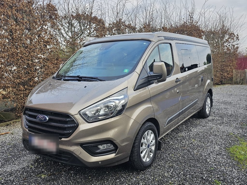 Ford Nugget PLUS 2023 automatique toit relevable WC 44.151km, Caravanes & Camping, Camping-cars, 5 à 6 mètres, Ford, Diesel, Automatique