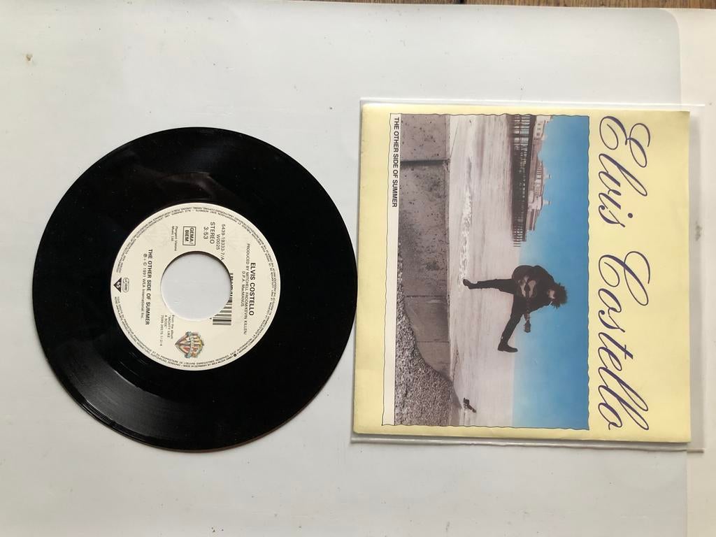Elvis Costello : l'autre côté de l'été (1991 ; neuf), Envoi, Comme neuf