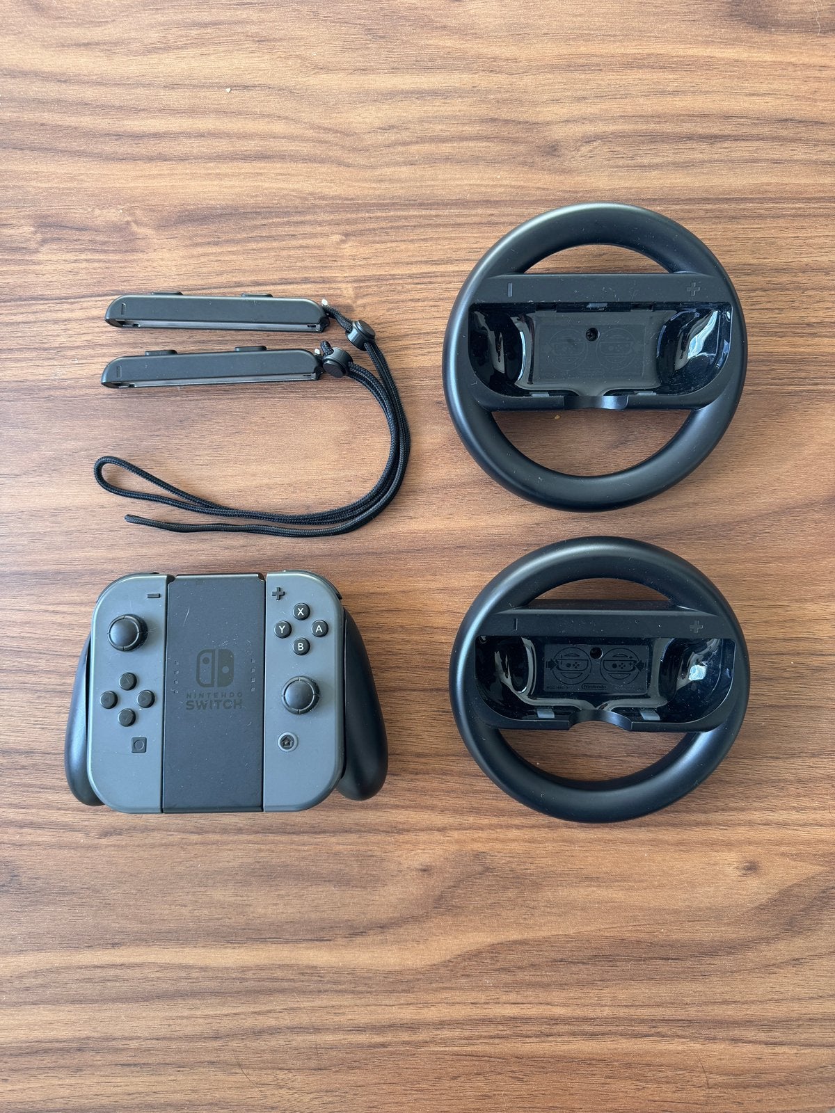 Nintendo Switch Joy-Cons, 2 stuurwielen, grip & polsbandjes, Games en Spelcomputers, Ophalen of Verzenden, Zo goed als nieuw, Switch