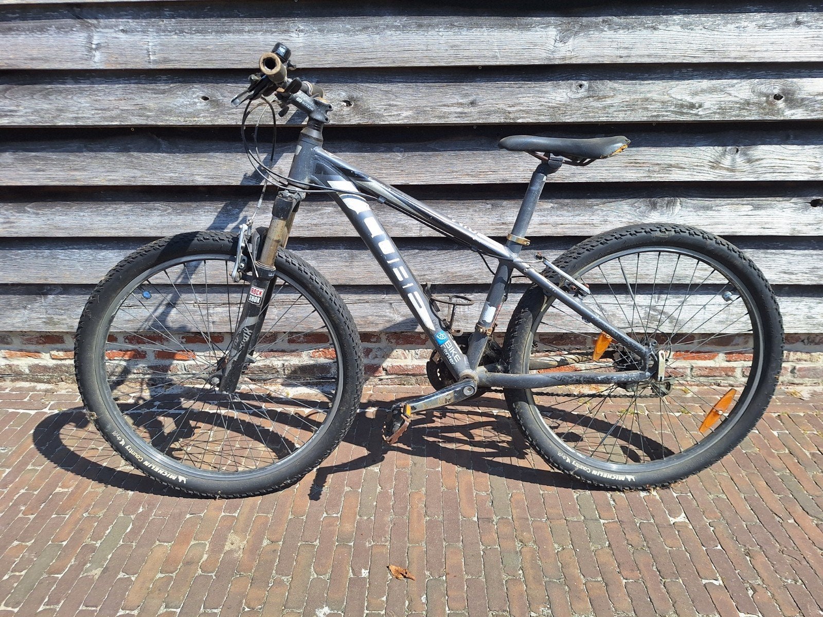 Een 3 tal (cross)mountainbikes, Ophalen