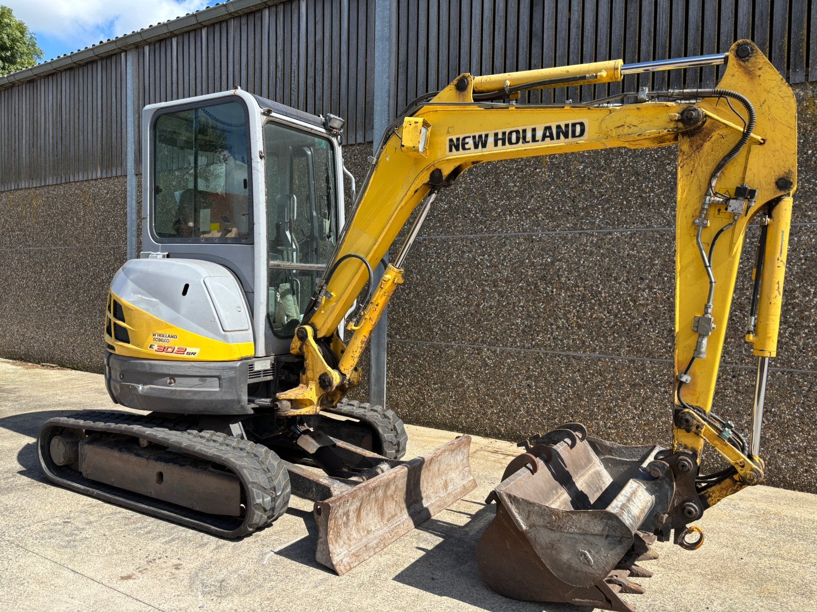 Minigraver New holland 30.2 in prima staat amper 1700 uren, Zakelijke goederen, Machines en Bouw | Kranen en Graafmachines, Ophalen
