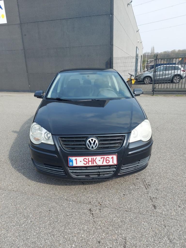 Volkswagen Polo 2006 1.2 benzine blanco gekeurd voor verkoop, Auto's, Voorwielaandrijving, Stof, Zwart, Elektrische ramen
