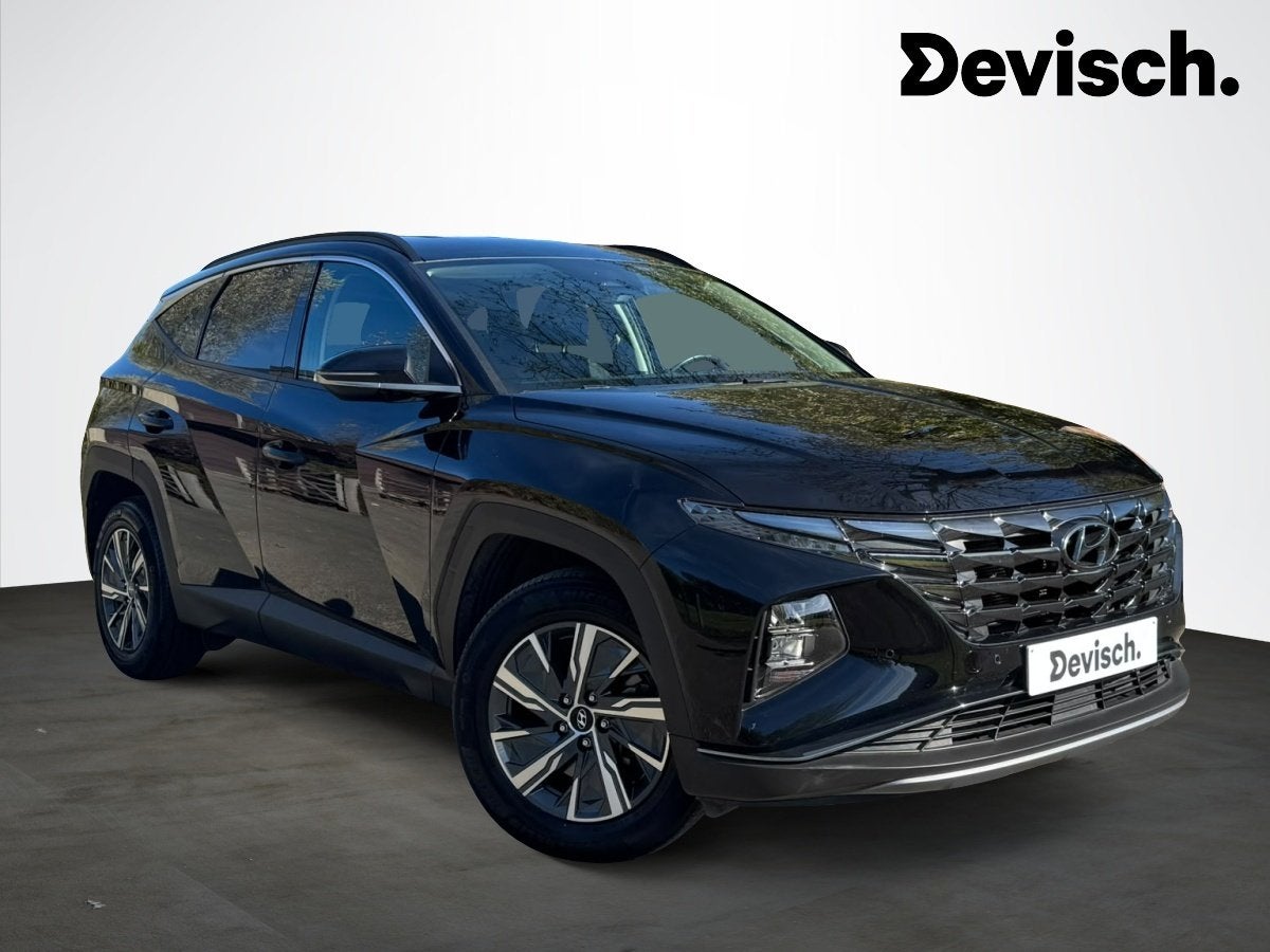 Hyundai NX4 TUCSON HEV FEEL - hybride automaat (bj 2021), Auto's, Stof, Gebruikt, 169 kW, Bedrijf