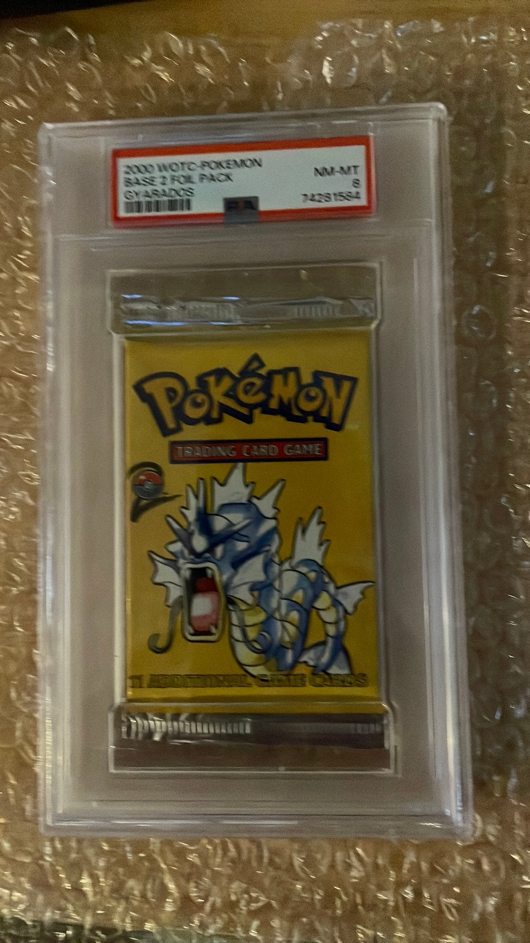 Base set 2 gyarados boosterpack  (psa 8)(heavy), Ophalen of Verzenden, Zo goed als nieuw