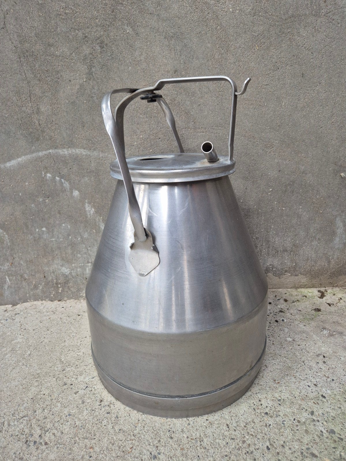 melkpot inox, Ophalen