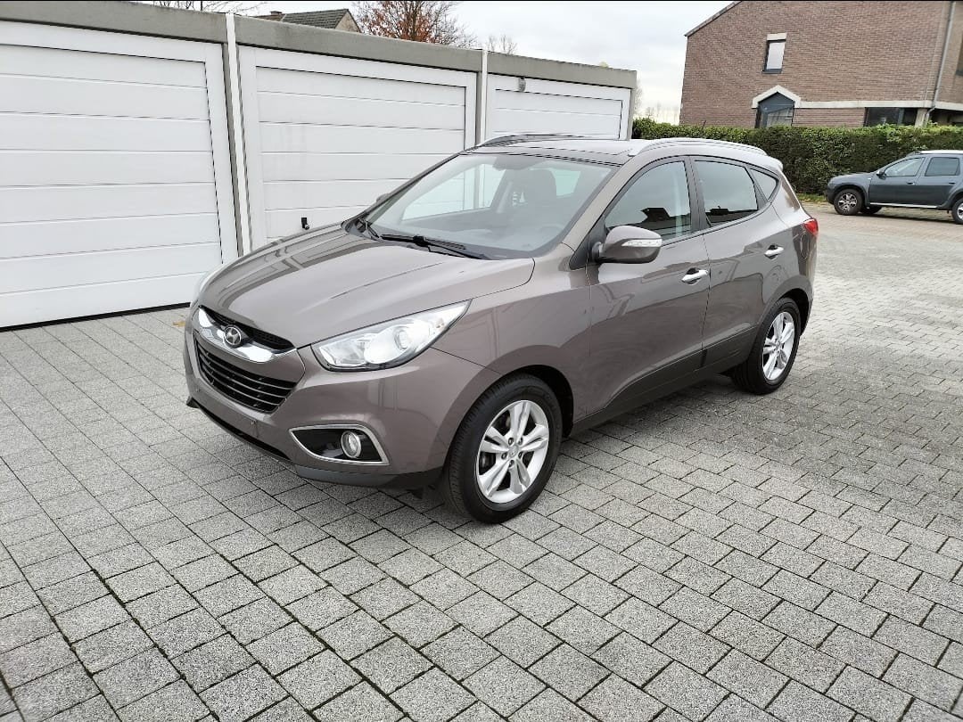 hyundai IX 35 1.6 benzine 135 pk Airco Euro 5 142.dkm bj2012, Auto's, Euro 5, Zwart, 4 cilinders, Bruin