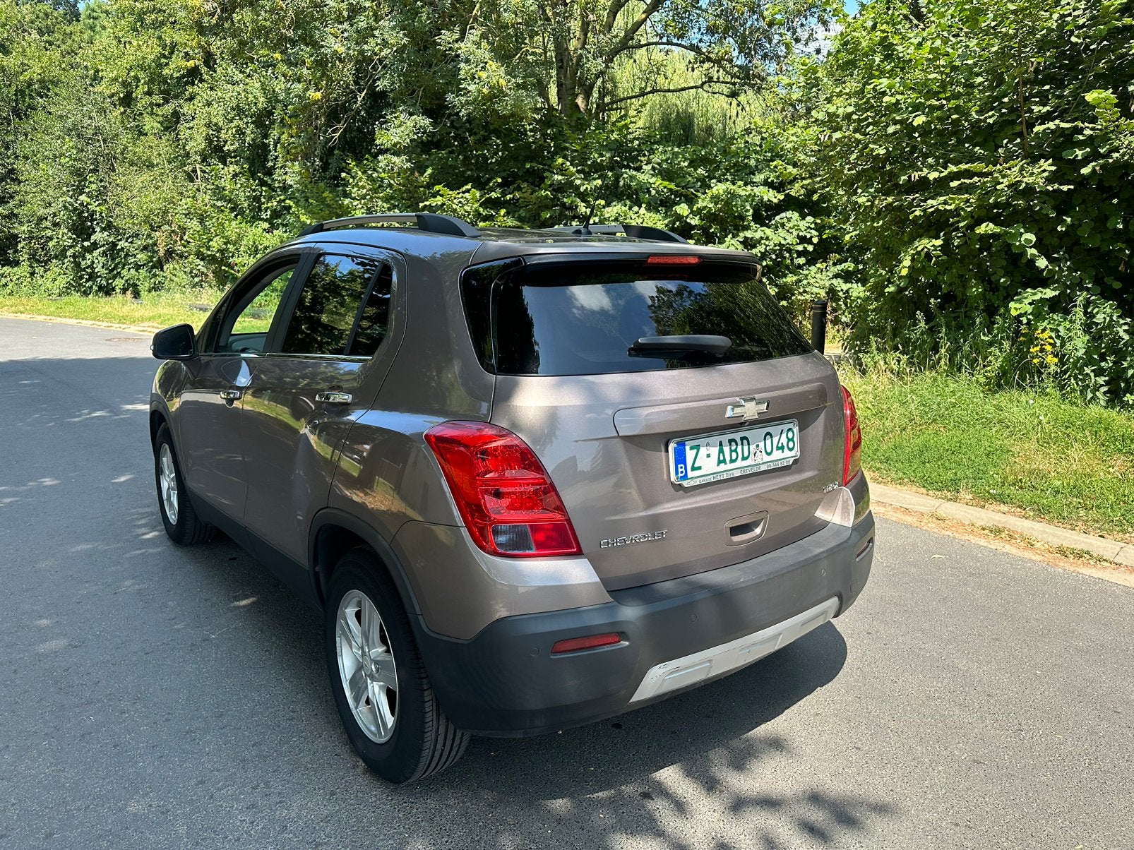 CHEVROLET TRAX • 82.000KM • ESSENCE •, Auto's, Voorwielaandrijving, Euro 5, Stof, Zwart