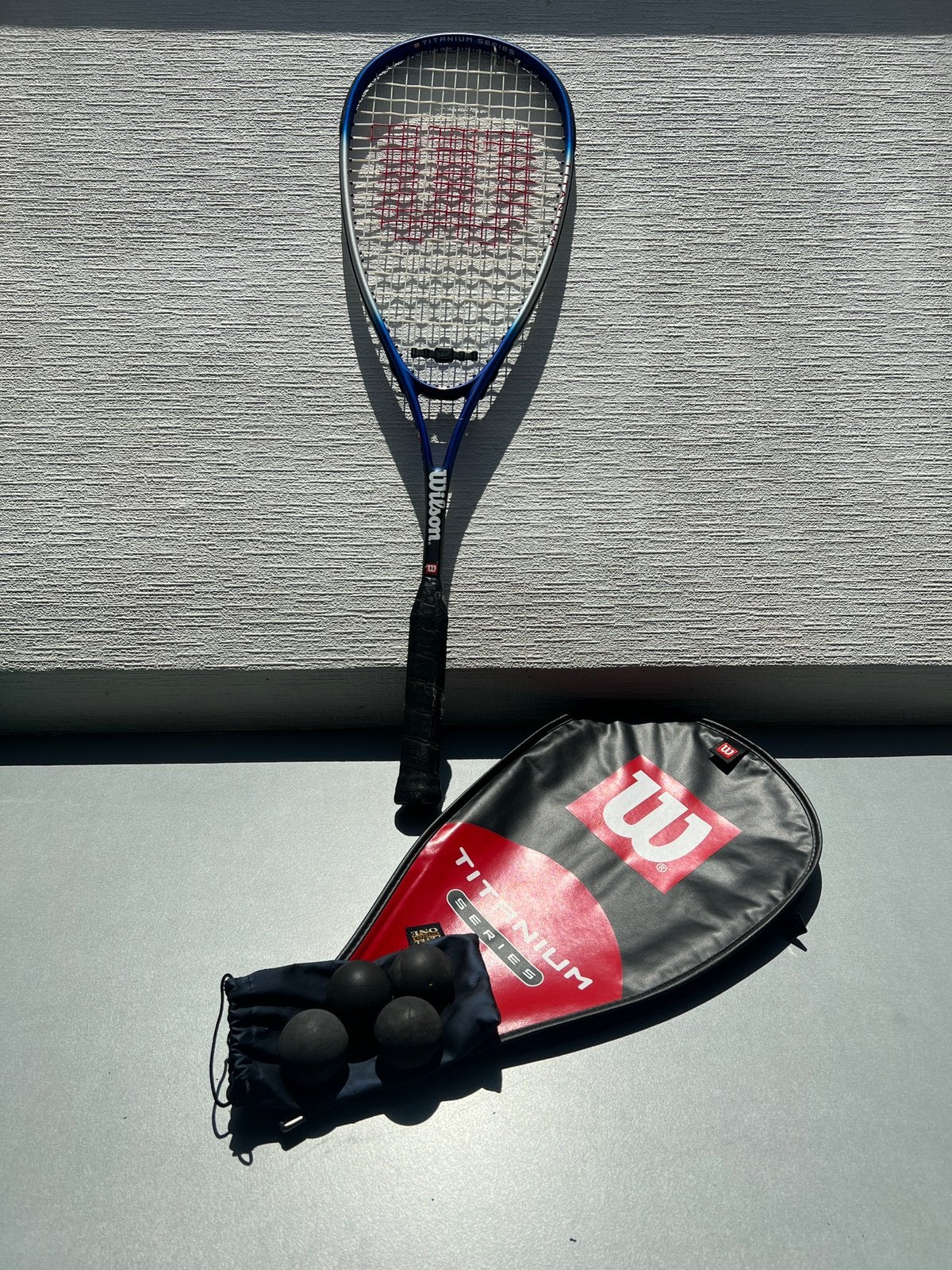 Raquette squash Titanium, Sports & Fitness, Squash, Enlèvement, Utilisé, Raquette, Avec housse