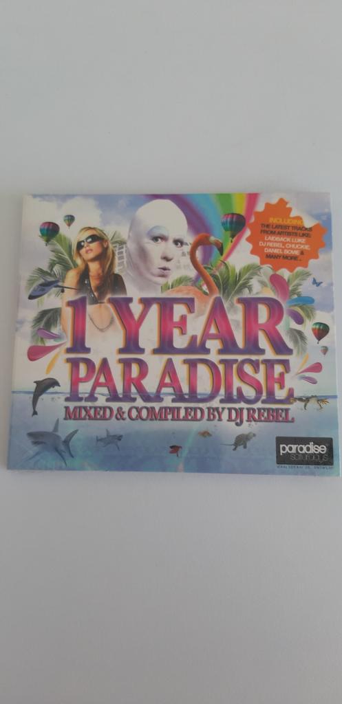 CD 1 Year Paradise. Mixed en Compiled bij DJ Rebel. Nieuw, Ophalen of Verzenden
