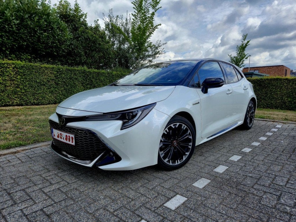 Toyota Corolla Hybrid 1.8 GR Sport, Auto's, Toyota, Dealer onderhouden, 4 cilinders, Parkeerassistent, Wit