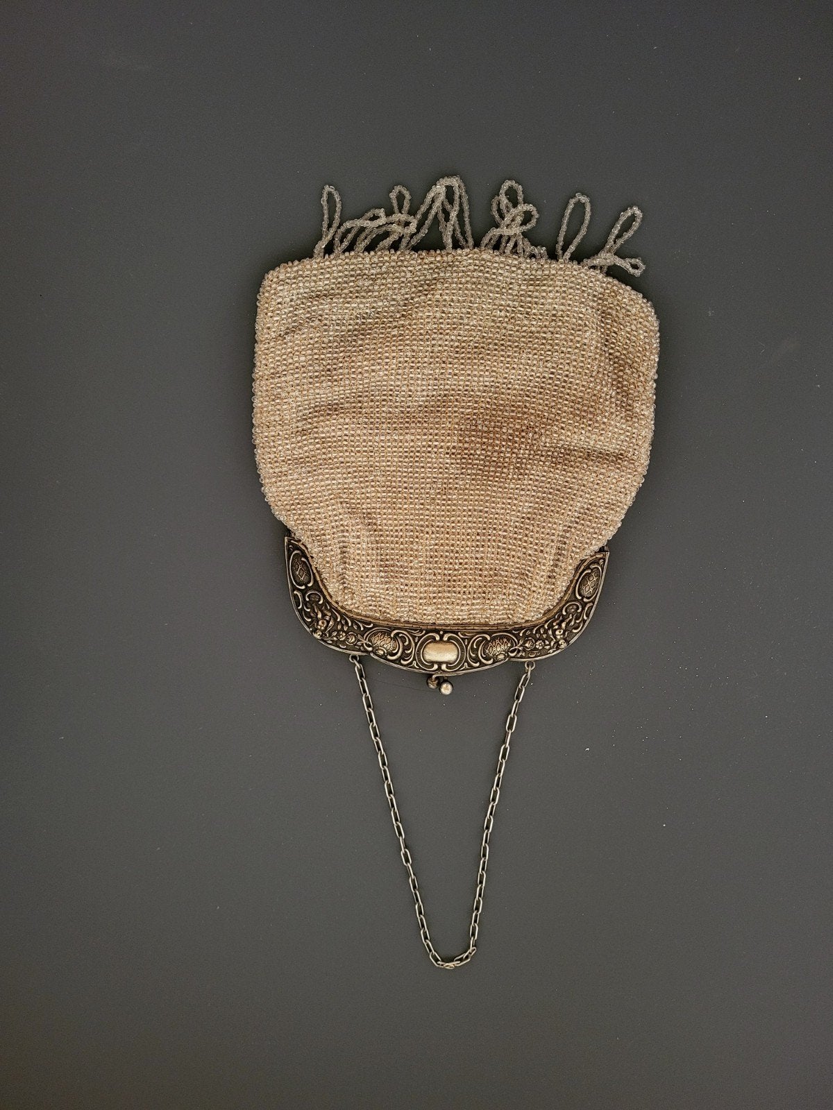 Klein handtasje, Ophalen