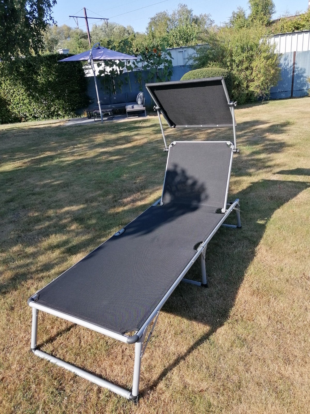 zwart ligbed met zonnescherm en hoofdsteun, Ophalen