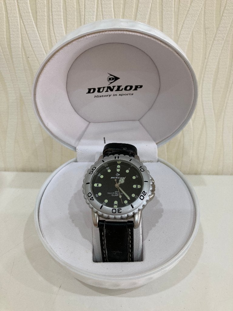 zolderopruiming: DUNLOP horloge in golfbaldoosje, Bijoux, Sacs & Beauté, Montres | Hommes, Montre-bracelet, Autres marques, Enlèvement ou Envoi