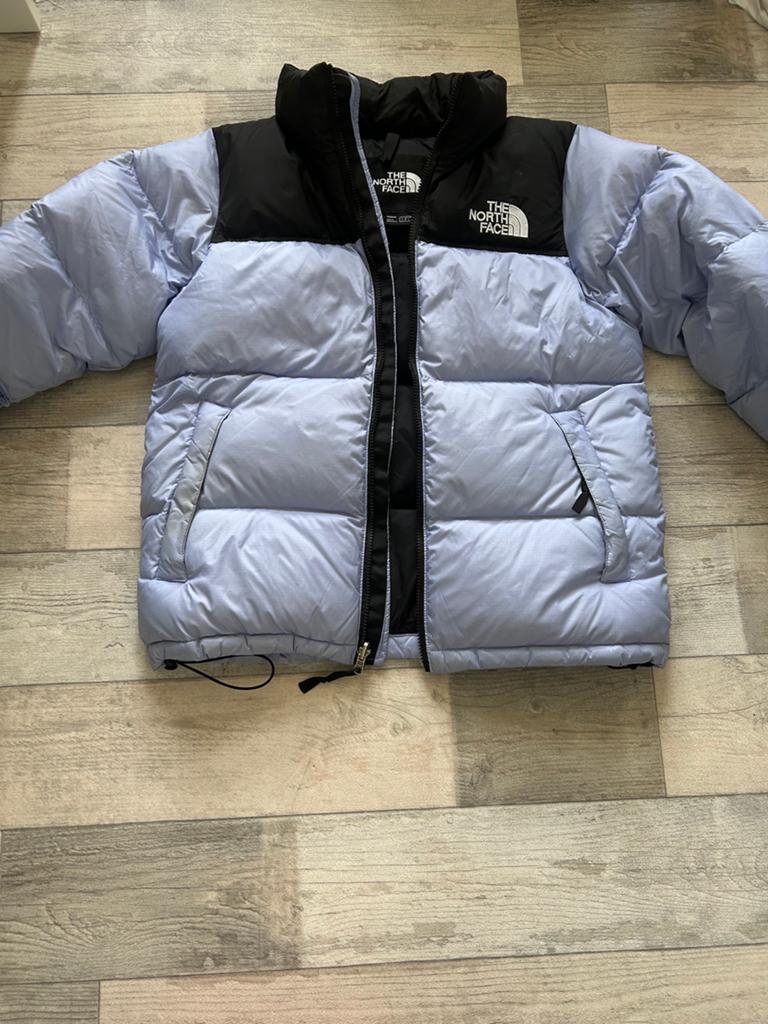 Het authentieke donsjack van The North Face, Ophalen