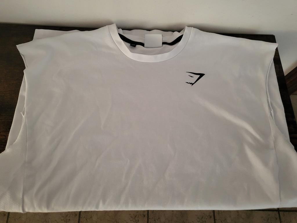 T-shirt sans manches Gymshark blanc, gilet noir, Enlèvement ou Envoi, Comme neuf, Taille 48/50 (M), Blanc