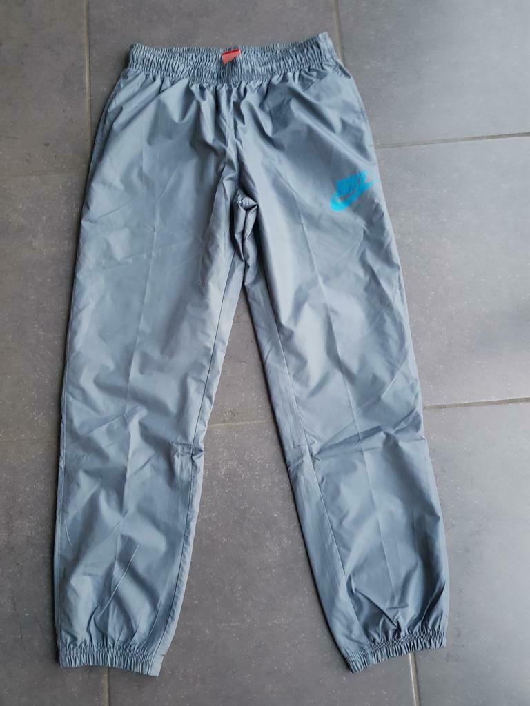 nieuwe lichtblauwe trainingsbroek - Nike - M, Ophalen, Maat 48/50 (M)