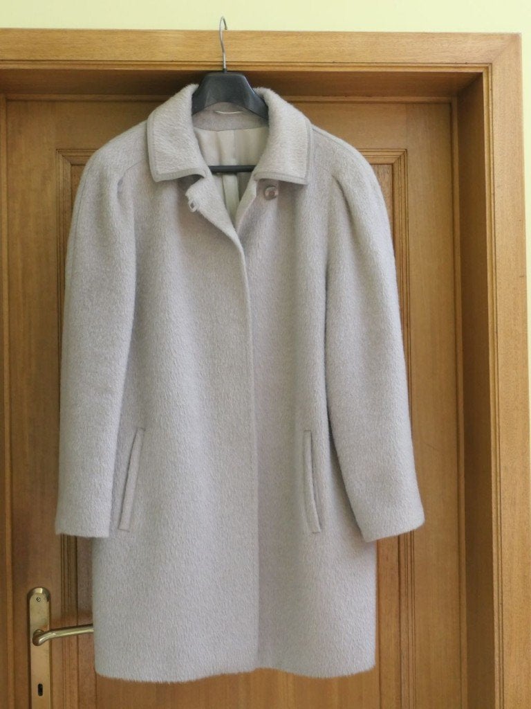 Taupe jas, Ophalen