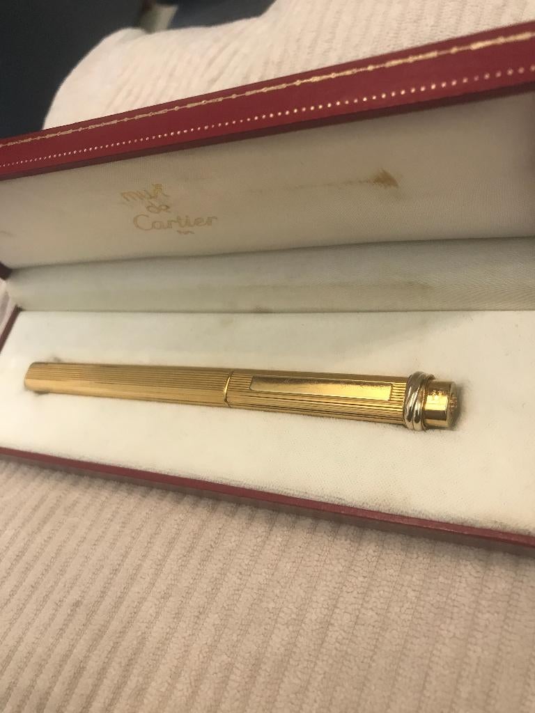 stylo bille must de cartier Trinity plaque or, Autres marques, Avec boîte, Stylo, Enlèvement
