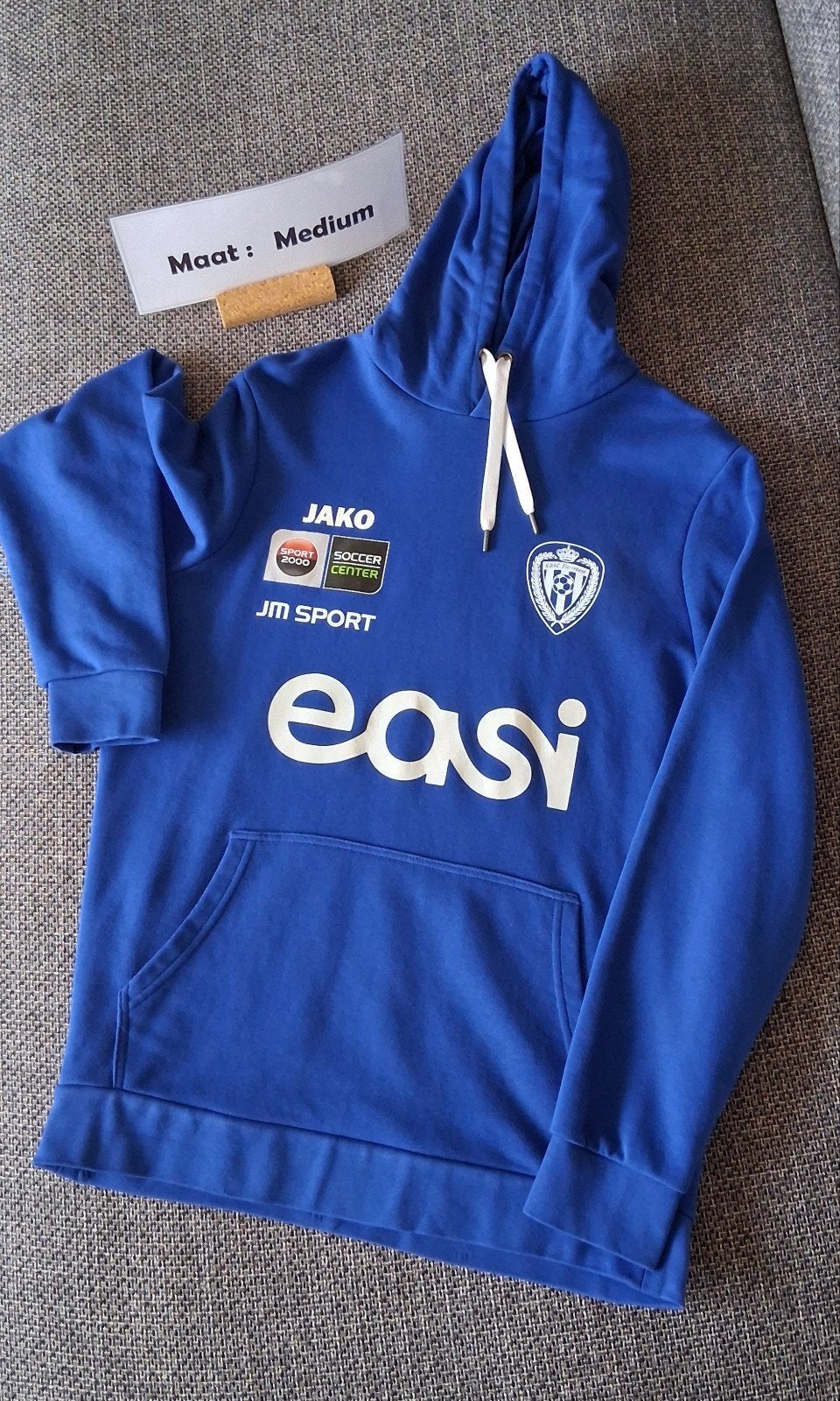 Sweat à capuche officiel JAKO K.O.V.C Sterrebeek, Taille M, Enlèvement ou Envoi, Neuf, Accessoires de club