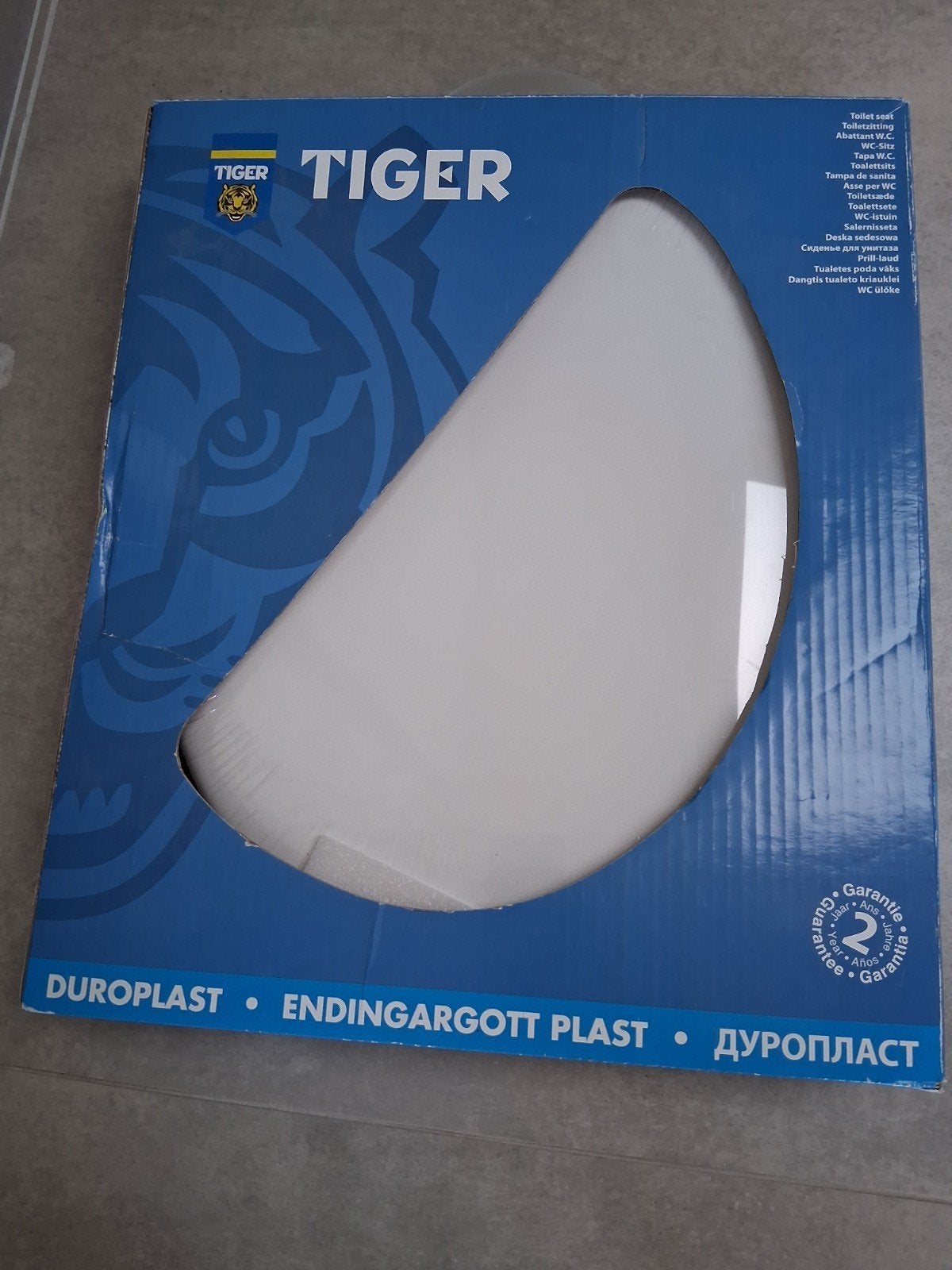 siège de toilette blanc neuf dans un emballage Tiger, Enlèvement ou Envoi