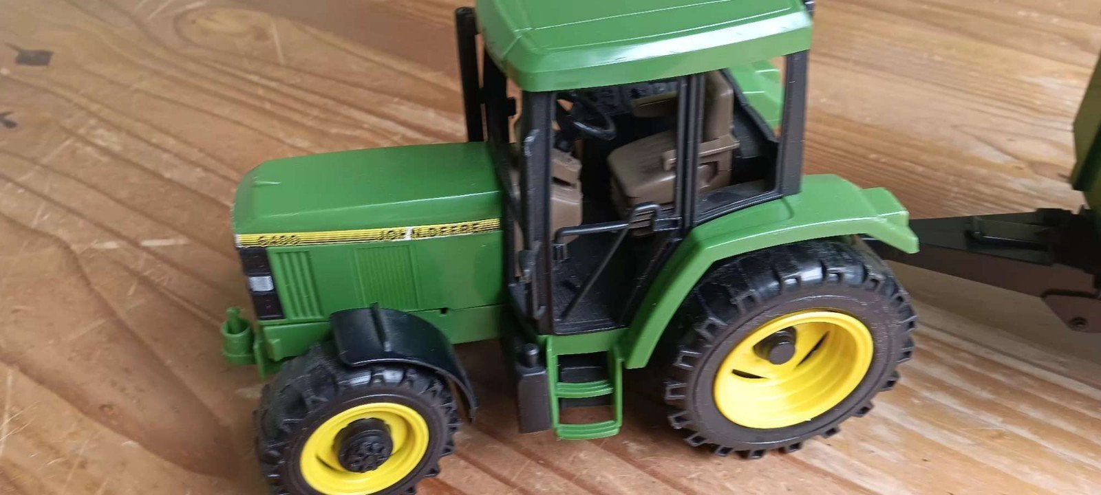 tractor met aanhangwagen John Deere, Ophalen