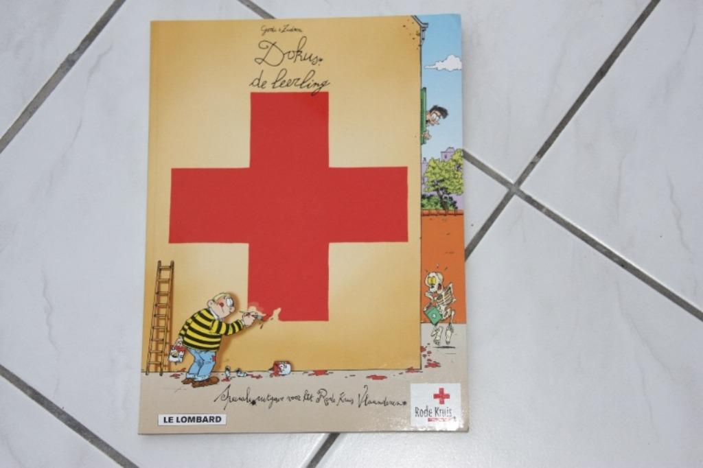 DOKUS, de leerling (RODE KRUIS stripuitgave), Boeken, Eén stripboek, Ophalen of Verzenden, Zo goed als nieuw