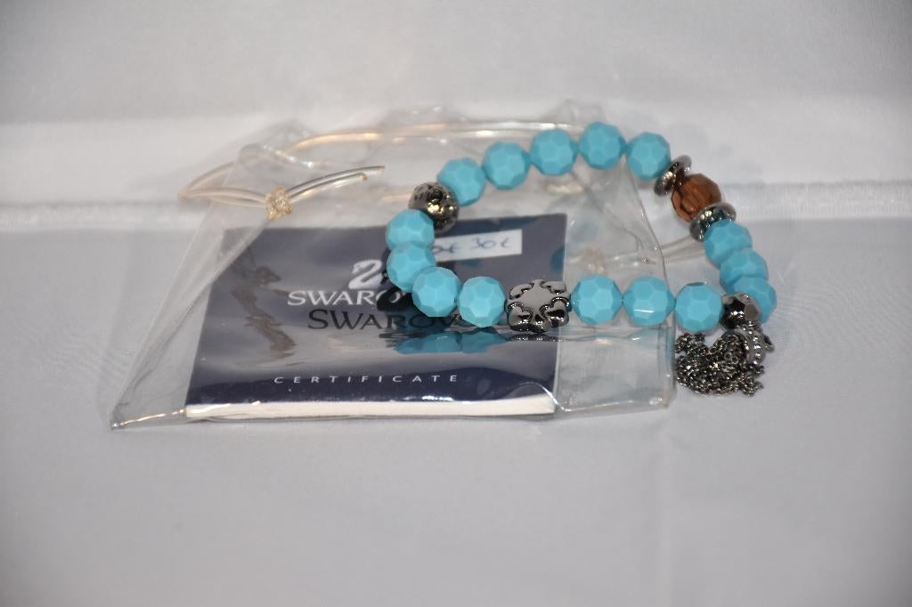 Bracelet bleu Swarovski, Ophalen, Zo goed als nieuw, Sieraad of Horloge