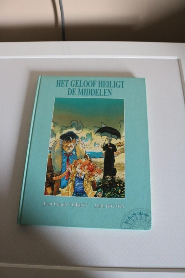 Het geloof heilight de middelen - HC - 1e druk 1995, Boeken, Eén stripboek, Ophalen of Verzenden, Gelezen