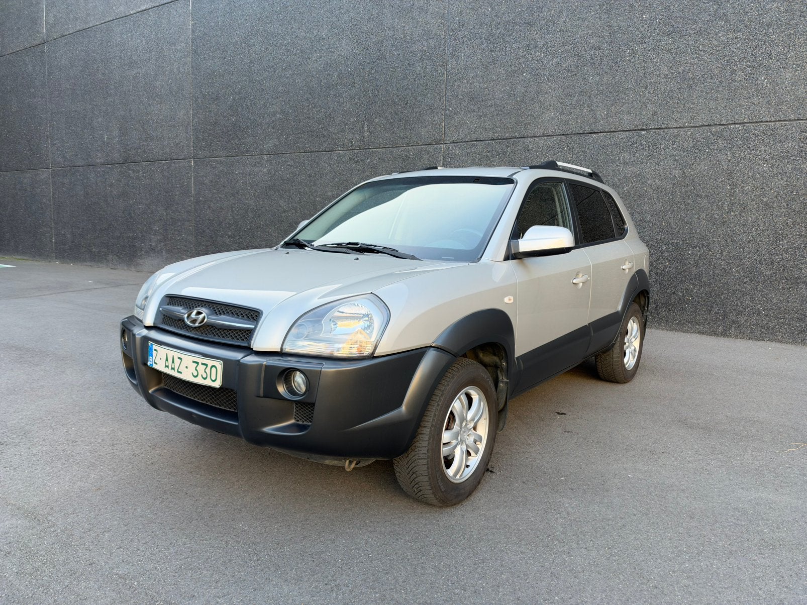 Hyundai Tucson 2.0i benzine - 90.000 kms, Auto's, Voorwielaandrijving, Stof, Zwart, 4 cilinders