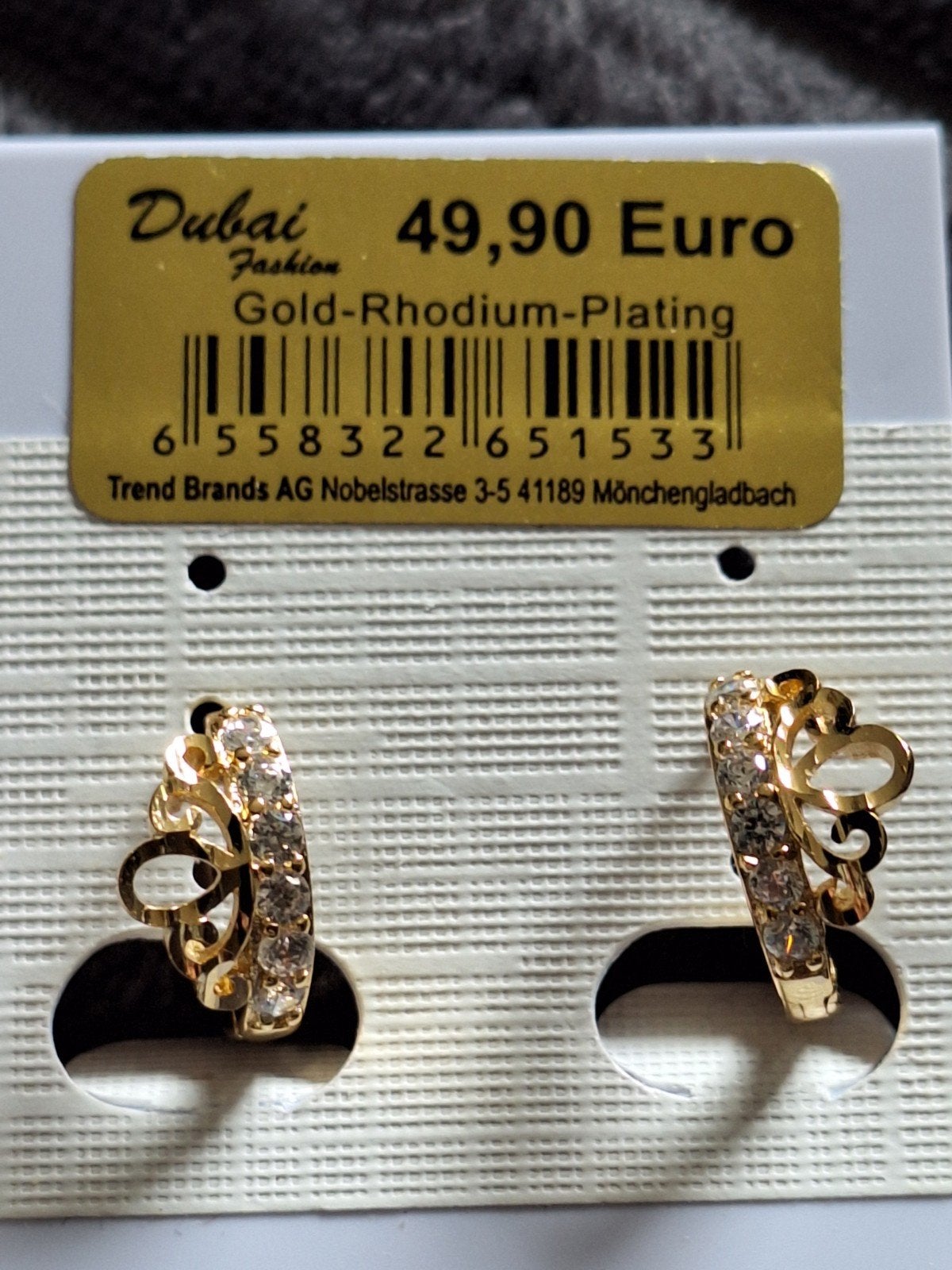 Nieuwe oorringen 14 kt doublé, Ophalen