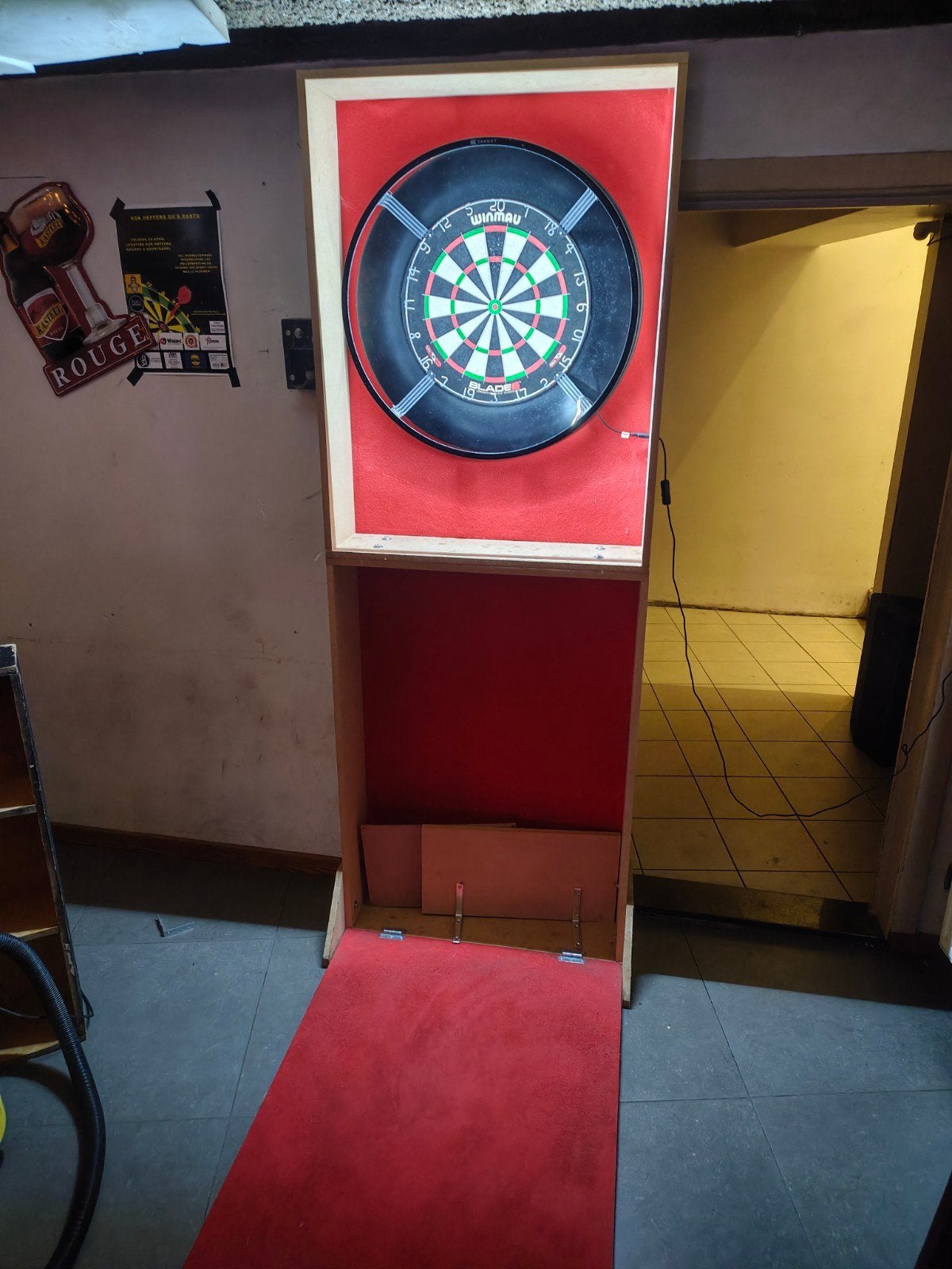 dartskast, Enlèvement