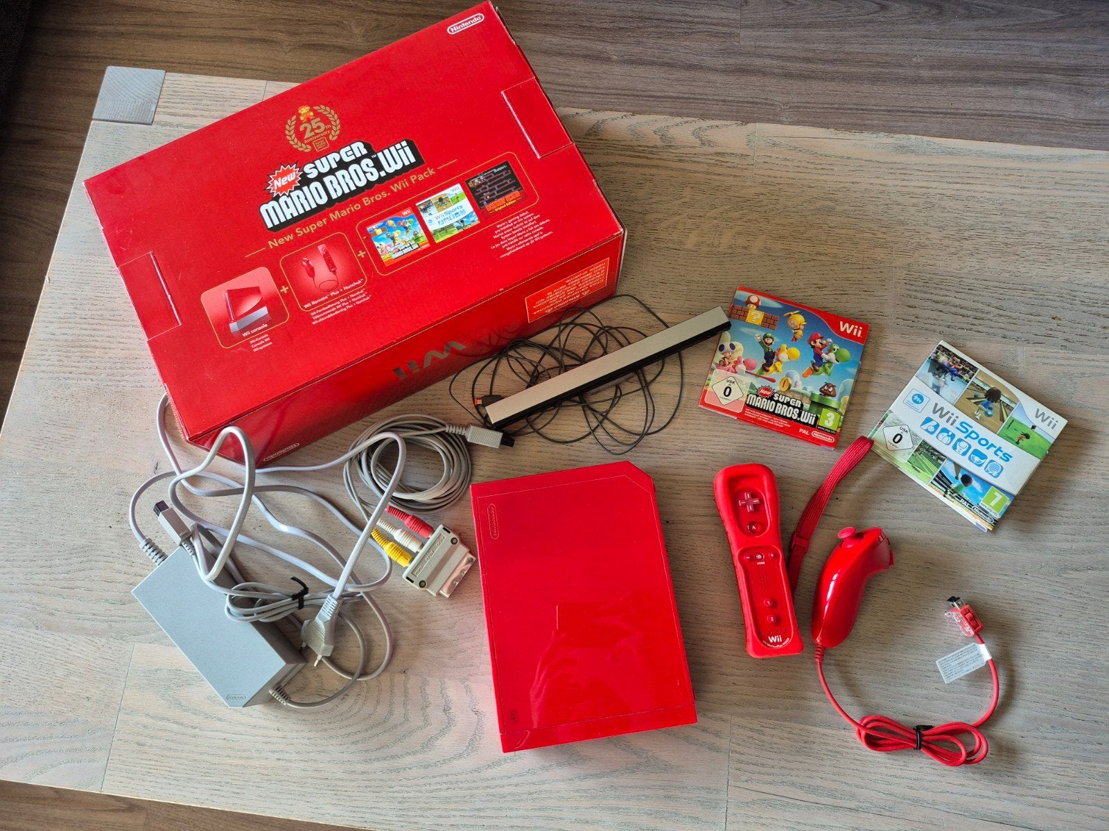 Wii New super Mario bros limited edition 25th anniversary, Ophalen of Verzenden, Zo goed als nieuw, Met 1 controller, Met games