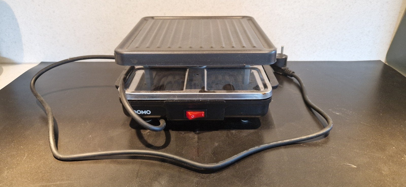 Domo Raclette en Gourmet, Ophalen