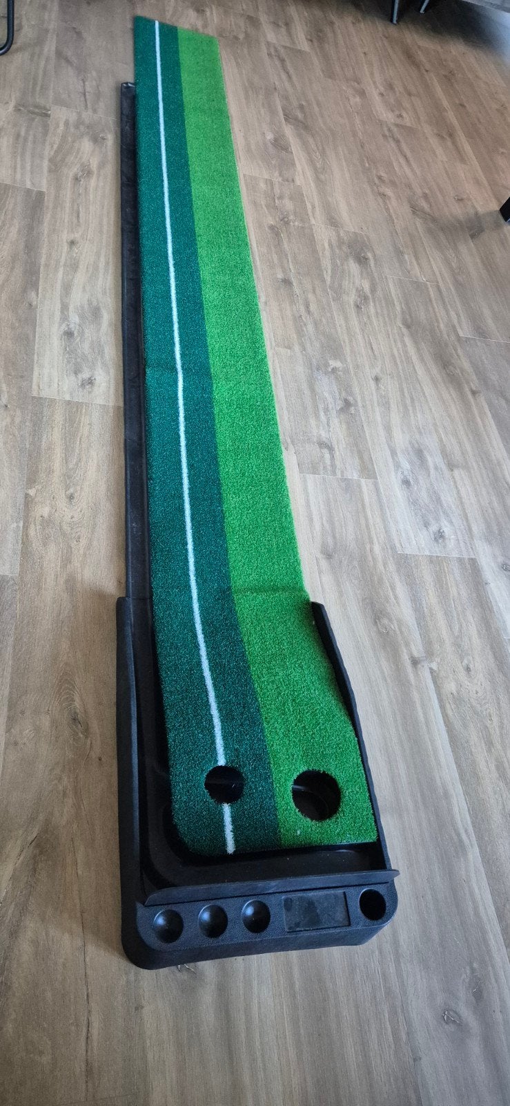 Golf putting mat putten, Ophalen