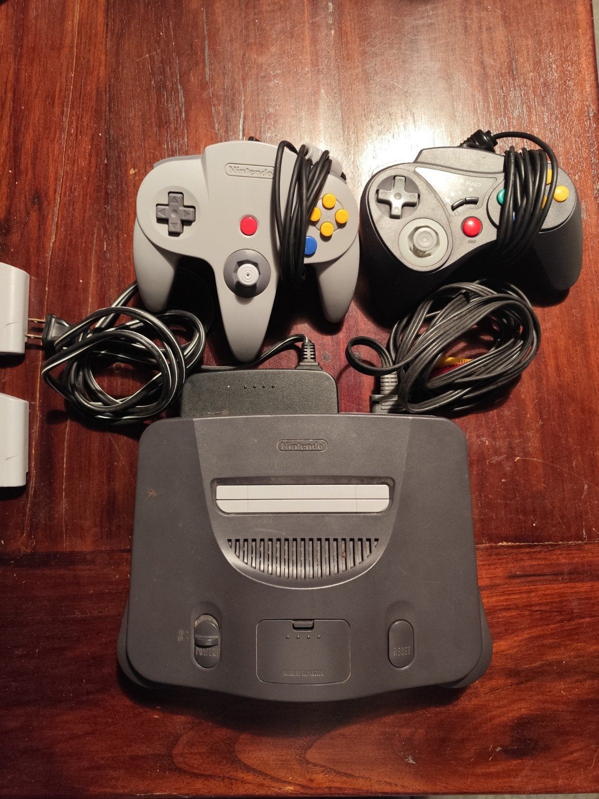 Nintendo 64 US (NTSC) + 2 manettes + 8 jeux cultes, Enlèvement