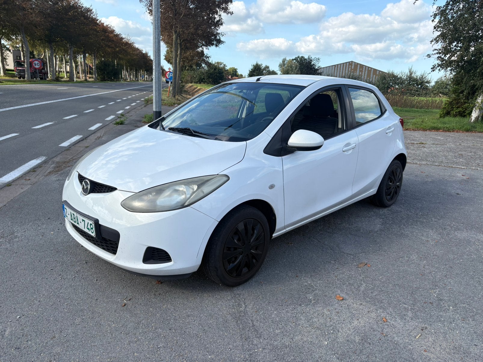 Mazda 2 benzine bouwjaar 2010, Auto's, Zwart, 4 cilinders, Wit, Bedrijf