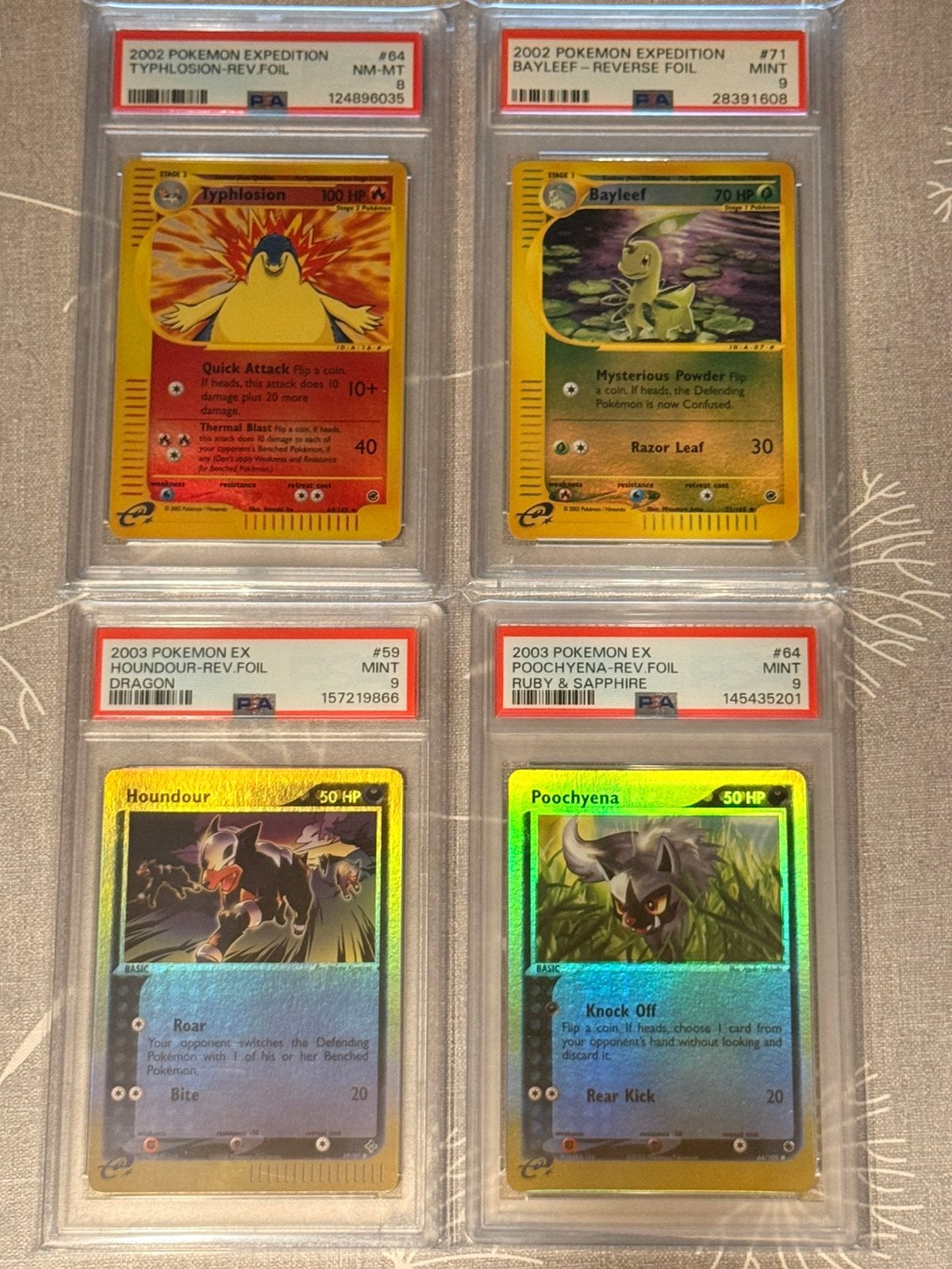 Typhlosion, Bayleef, Houndour, Poochyena PSA 8 / PSA 9, Ophalen of Verzenden, Nieuw, Meerdere kaarten, Foil
