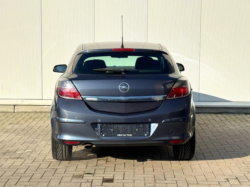 ✅ Opel Astra GTC 1.6i GARANTIE Airco Parkeersensoren, Auto's, Voorwielaandrijving, Zwart, 4 cilinders, Parkeersensor