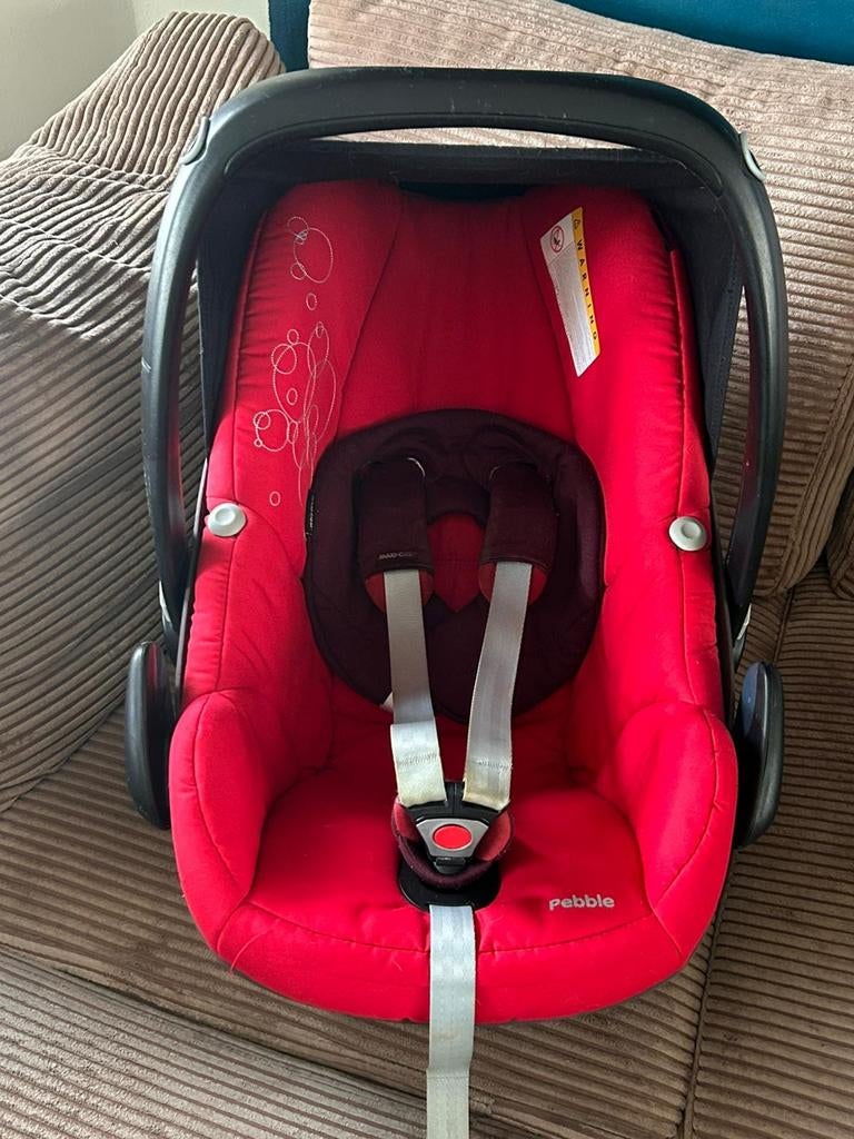 Maxi cosi autostoel met extra spullen, Ophalen