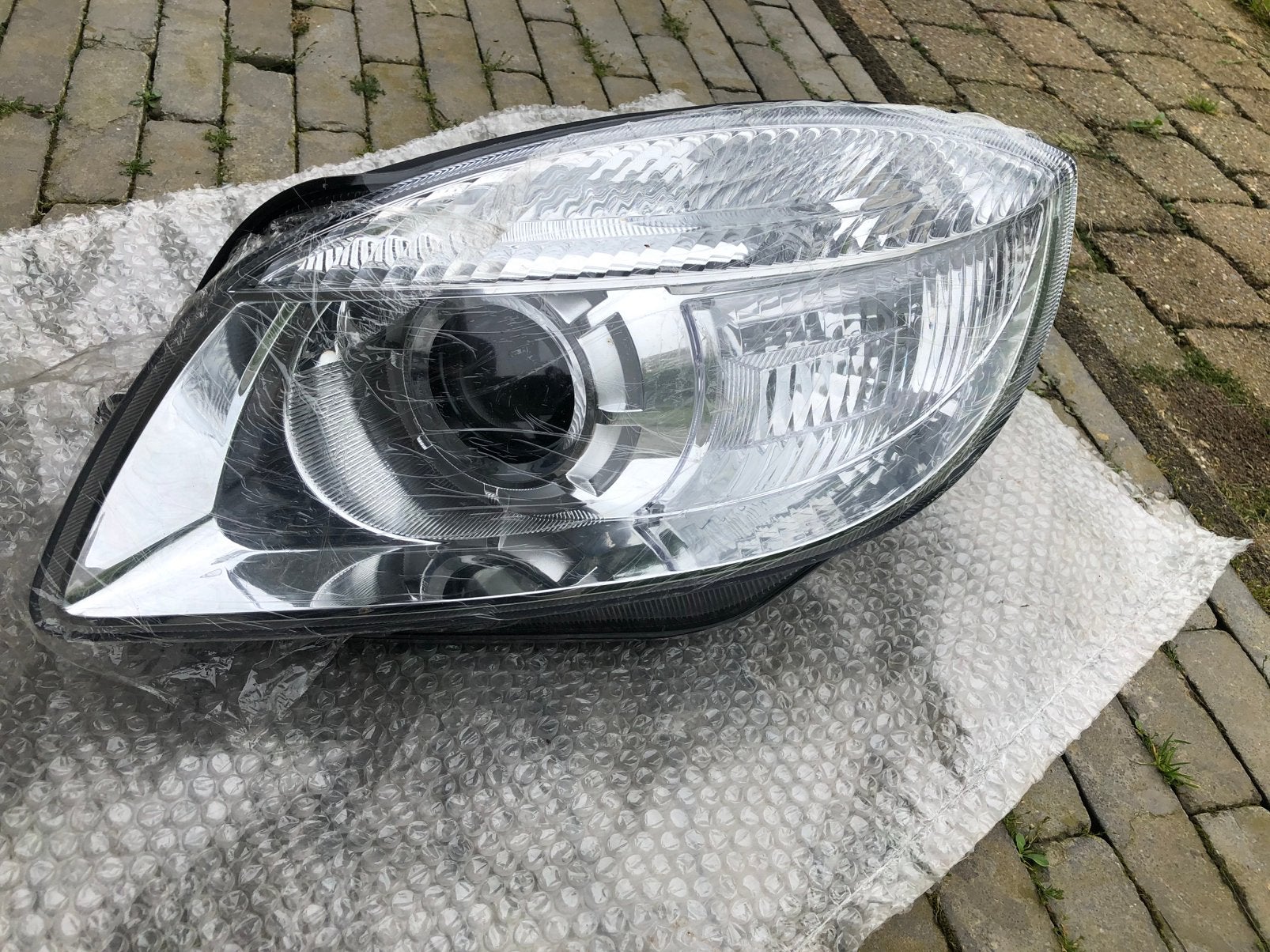 Skoda Roomster 5j koplamp Links Nieuw, Auto-onderdelen, Ophalen of Verzenden, Skoda