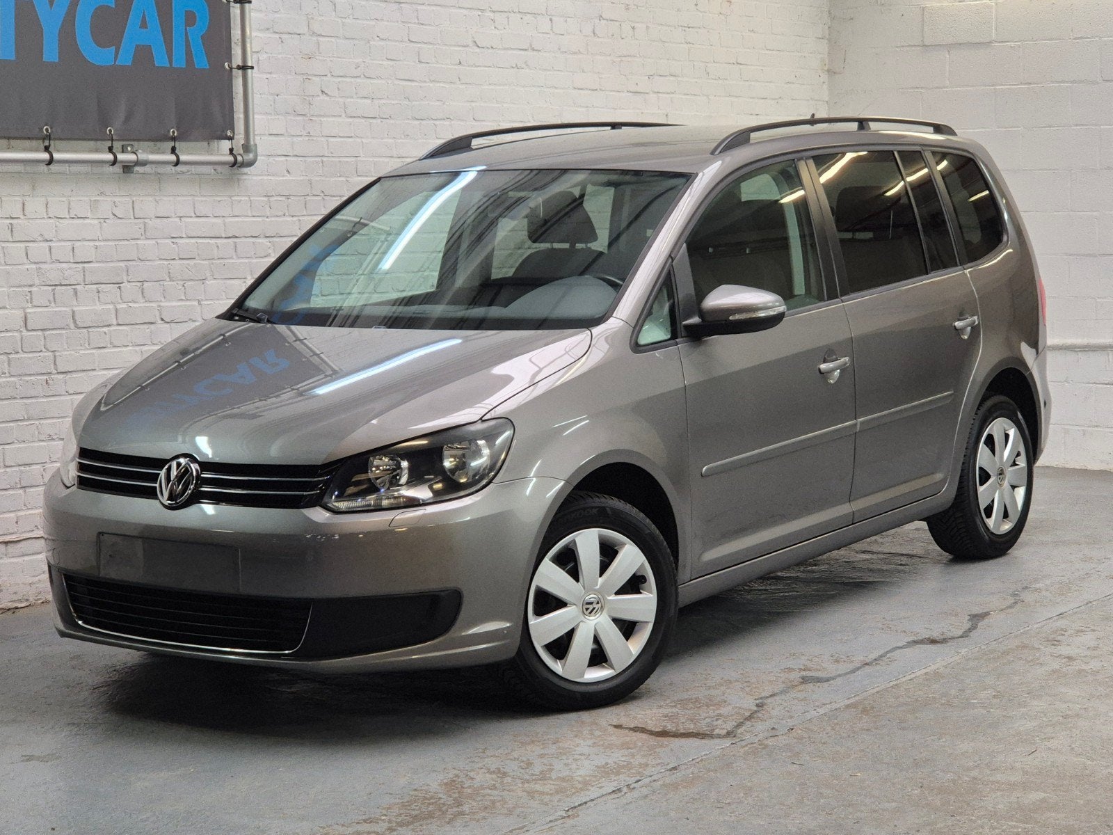 Vw Touran 1.2TSi -Euro5- 7 pl.-1eig.-Topstaat - Garantie, Auto's, Zwart, 4 cilinders, Parkeersensor, Handgeschakeld