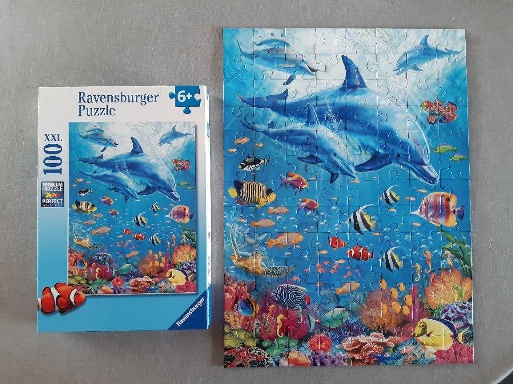 Puzzel Ravensburger 100 xl .Bijeenkomst van dolfijnen, Ophalen of Verzenden, Meer dan 50 stukjes, Zo goed als nieuw, 6 jaar of ouder