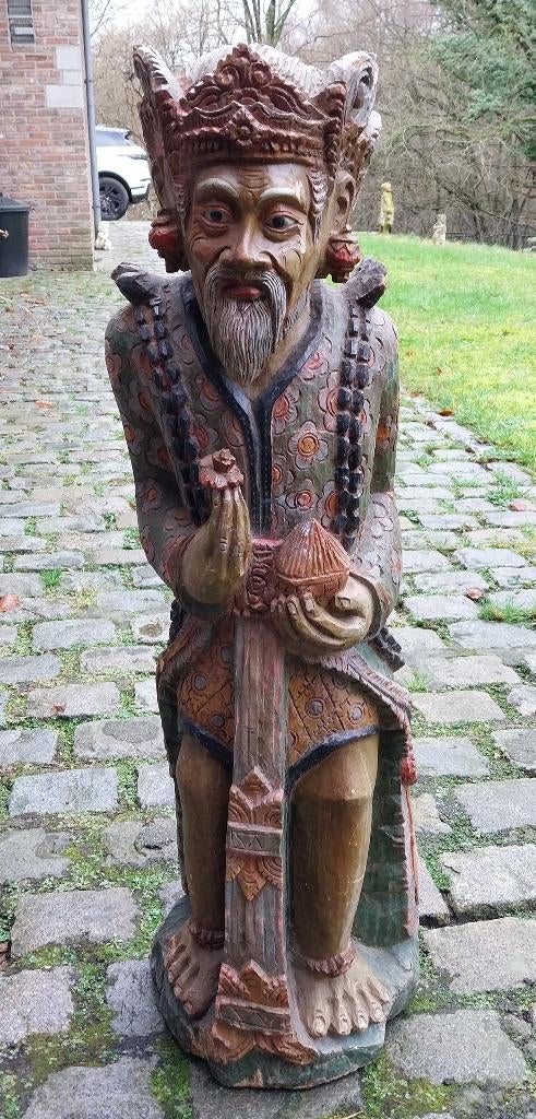 Houten beeld gesneden priester van Bali, Ophalen