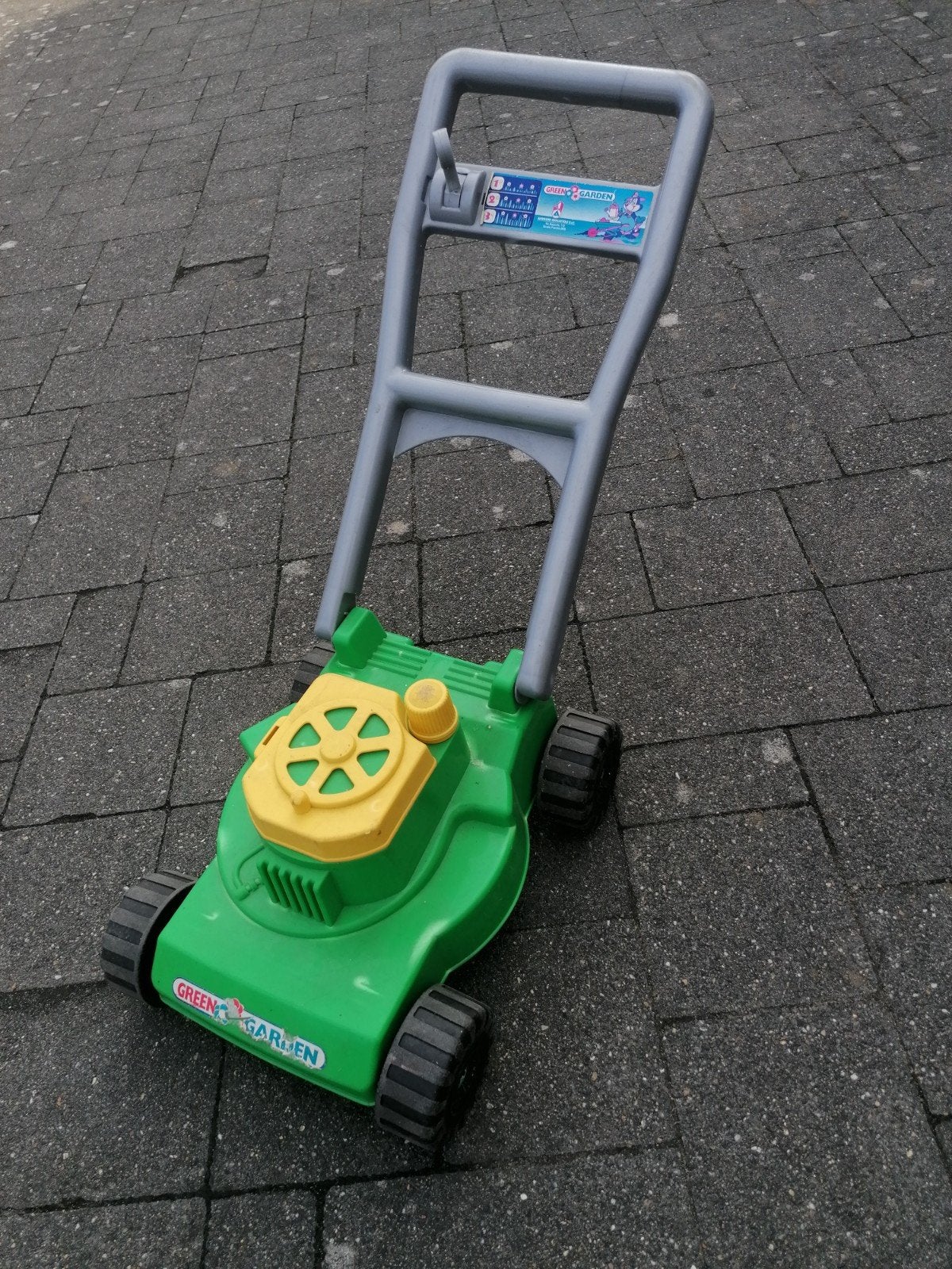 speelgoed grasmaaier, Ophalen