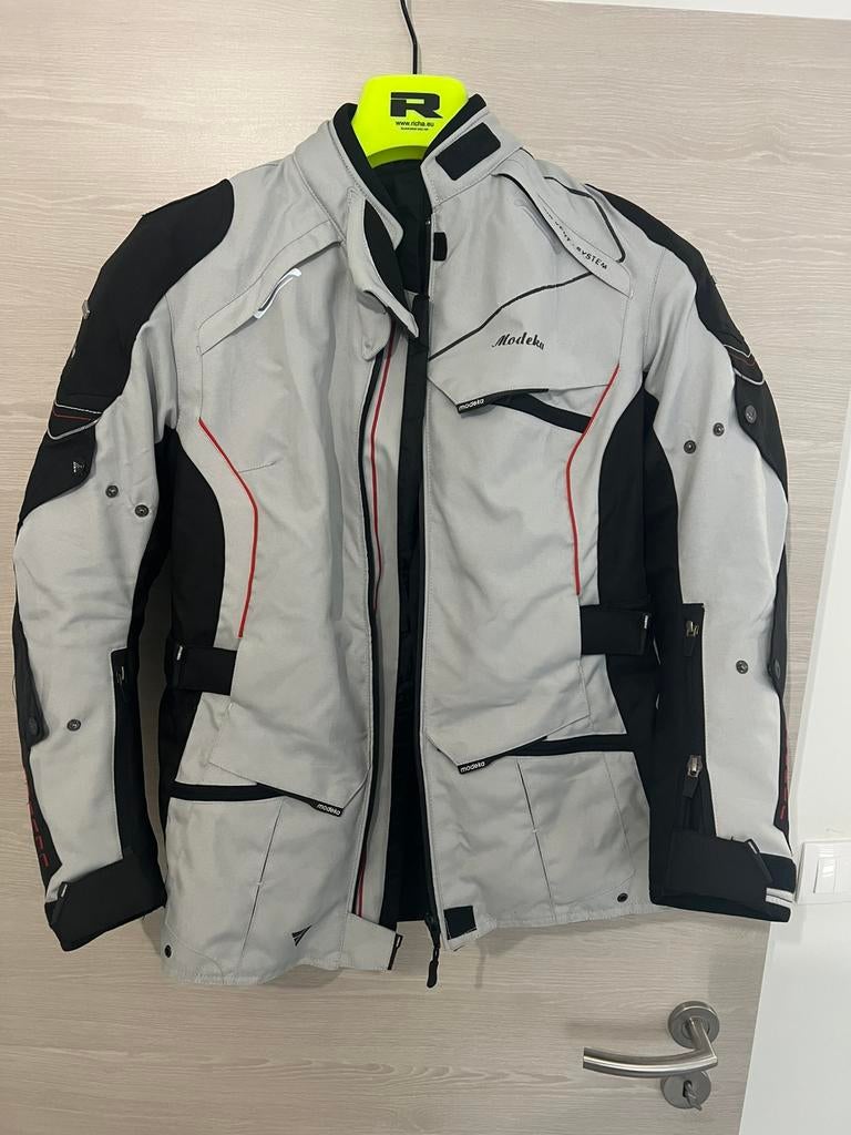 Veste Modeka Femme, Ophalen