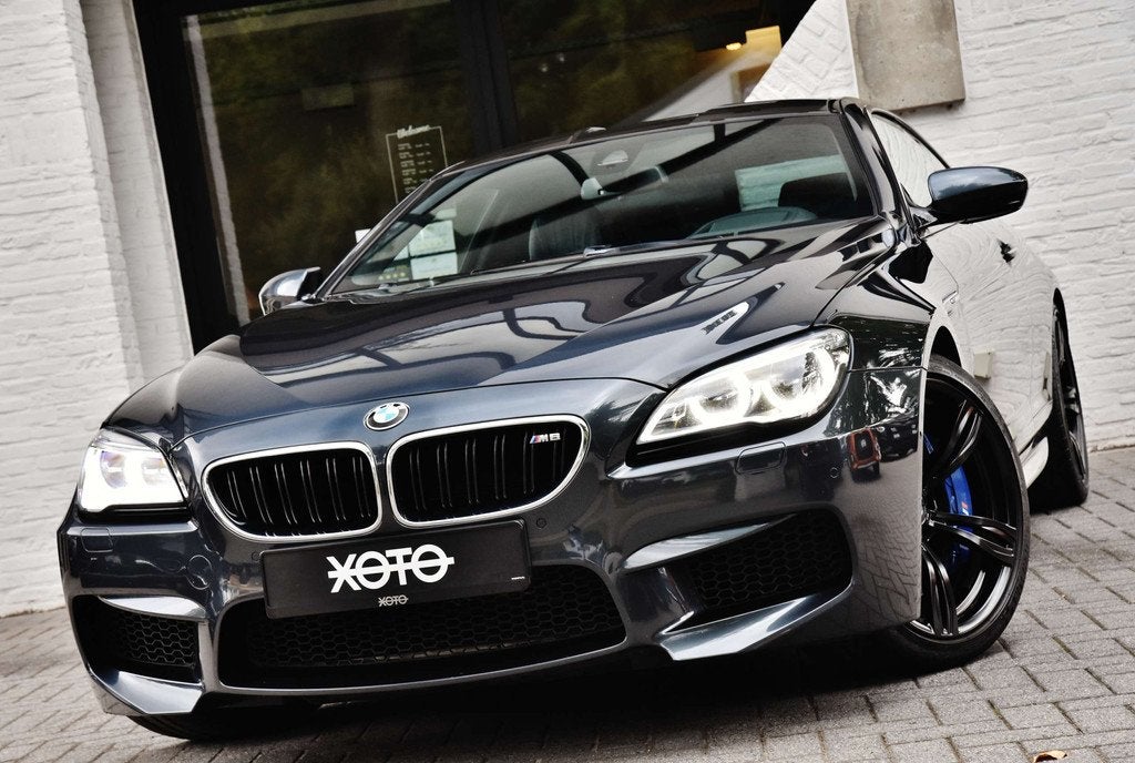 BMW M6 4.4 V8 DKG COUPE * FULL HISTORY / FULL OPTION *, Auto's, BMW, Automaat, 4 zetels, Achterwielaandrijving, Gebruikt